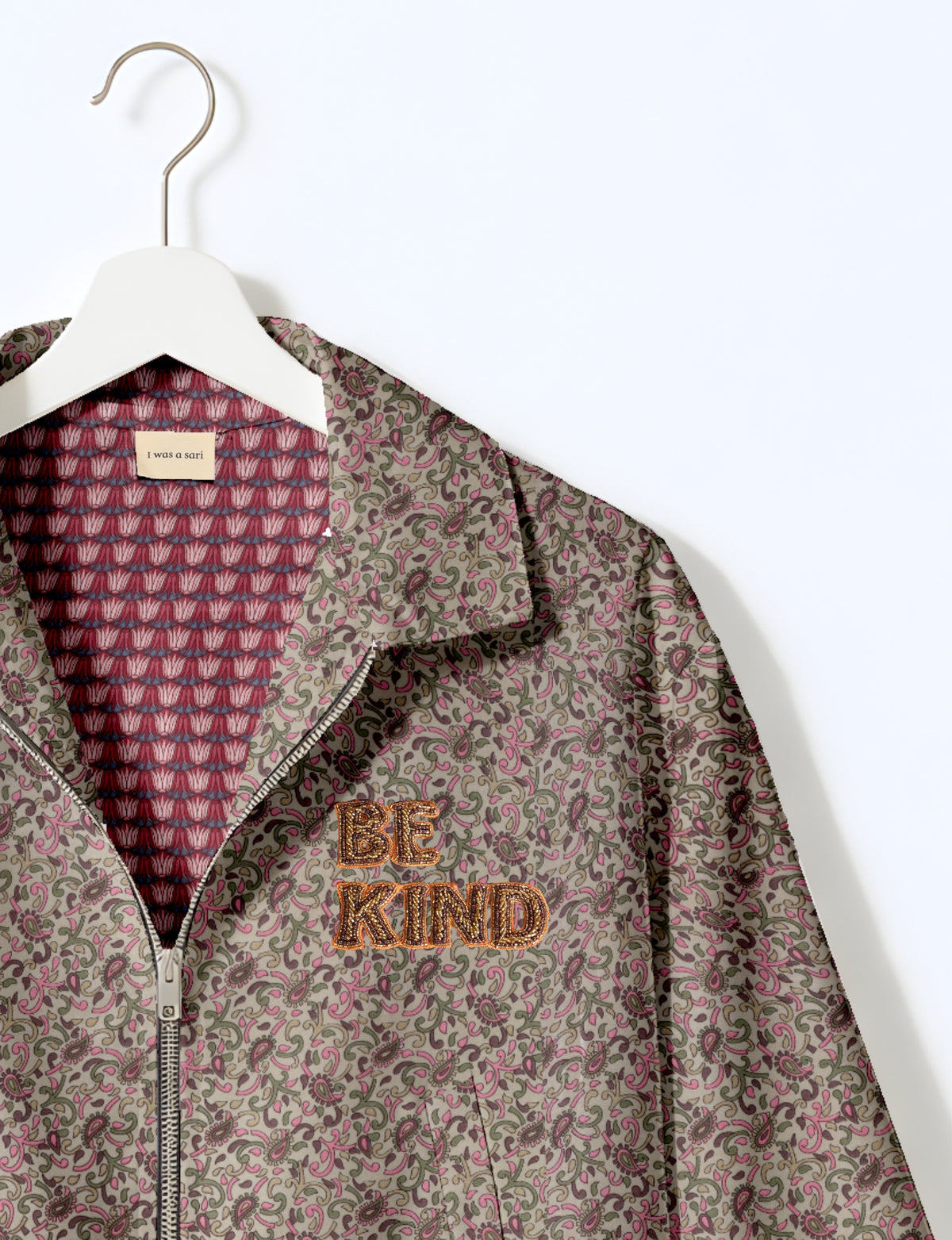 BE KIND Bomber jacket made from upcycled sari fabric with handcrafted Aari embroidery by female artisans.