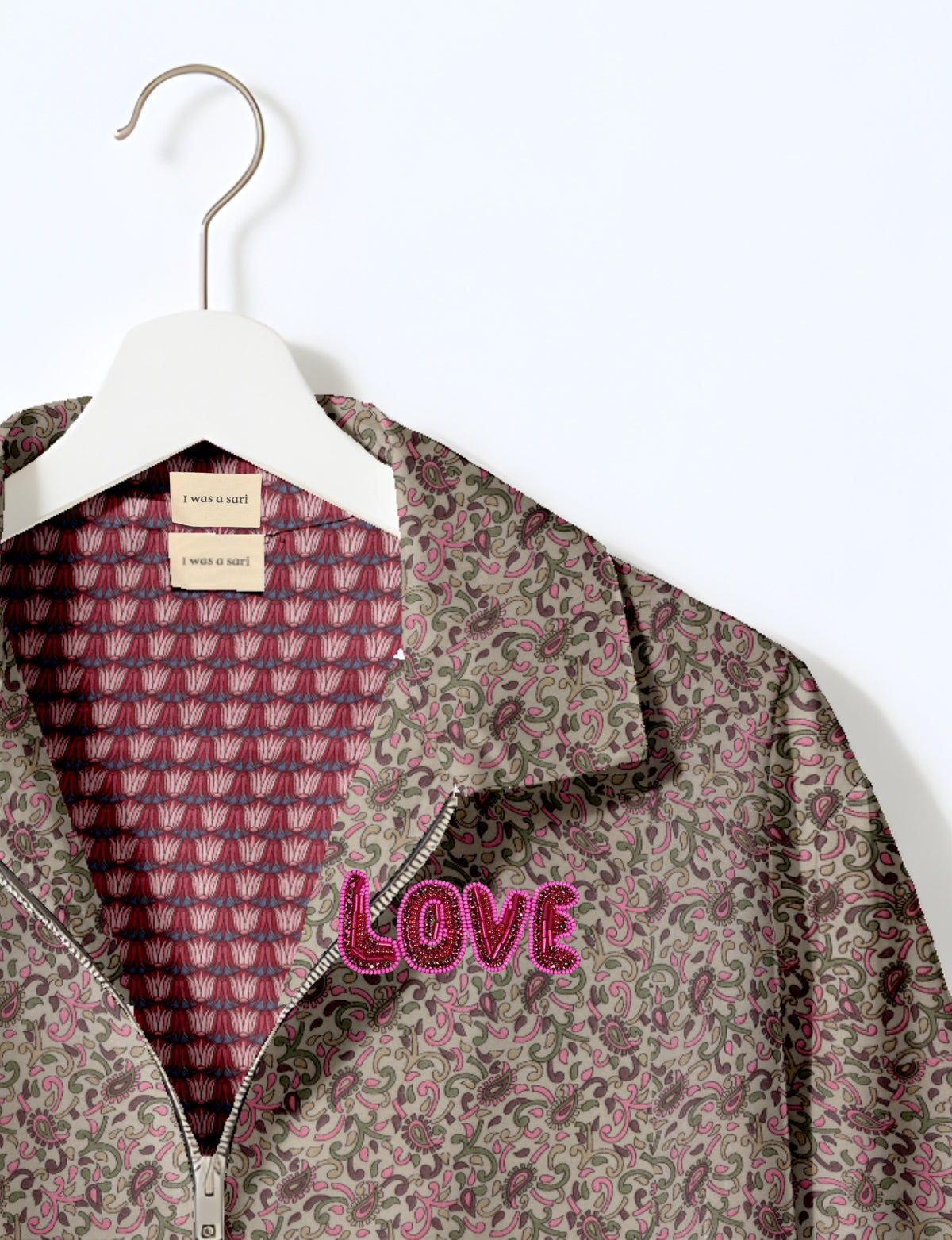 Love Bomber Jacket made from recycled fabric, featuring hand-stitched Aari embroidery. A unique piece of zero-waste clothing, part of the circular fashion movement. Designed with upcycled materials for a stylish yet environmentally friendly clothing choice.