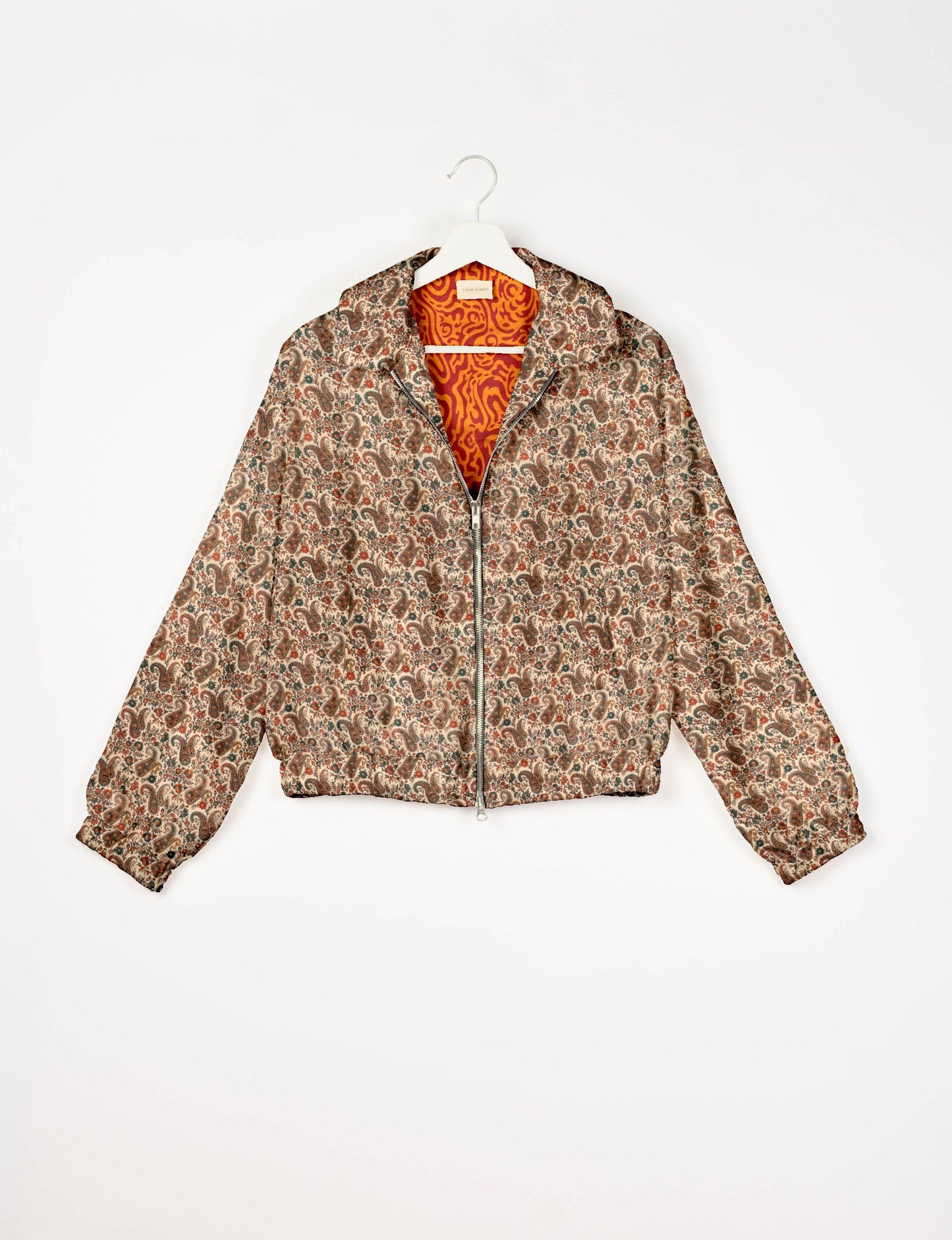 Stylish BOMBER JACKET, an upcycled clothing masterpiece with a cute cropped shape, elasticated details, and detachable metallic zipper. Contrast sari print lining adds a unique touch. Explore sustainable and eco-friendly fashion.