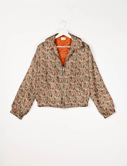 Stylish BOMBER JACKET, an upcycled clothing masterpiece with a cute cropped shape, elasticated details, and detachable metallic zipper. Contrast sari print lining adds a unique touch. Explore sustainable and eco-friendly fashion.