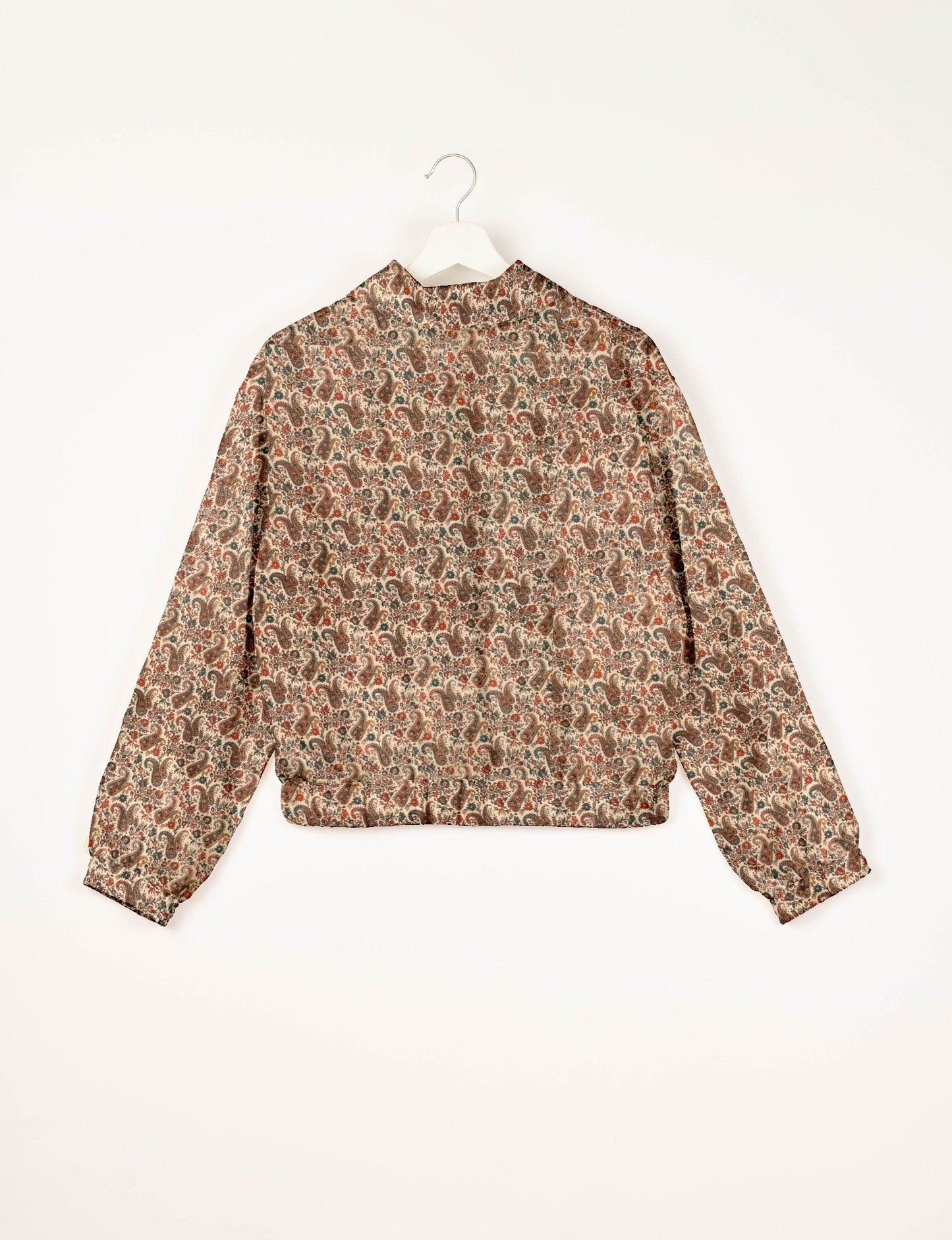 Stylish BOMBER JACKET, an upcycled clothing masterpiece with a cute cropped shape, elasticated details, and detachable metallic zipper. Contrast sari print lining adds a unique touch. Explore sustainable and eco-friendly fashion.