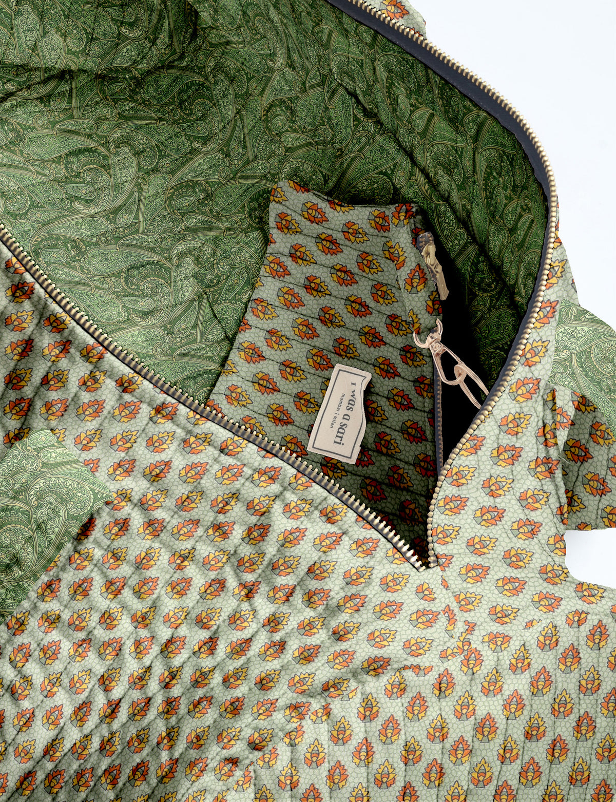 Brown paisley quilted bowling bag with dual handles, front zipper pocket, and "I was a sari" label on front side