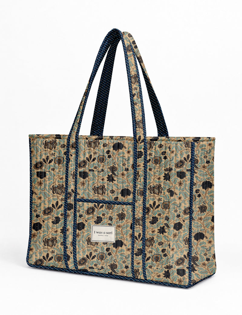 Quilted work tote bag with structured rectangular design and long shoulder straps, representing slow fashion and ethical clothing ideals, made as part of upcycled women's clothing and sustainable women's clothing using recycled fashion and earth friendly clothing practices.