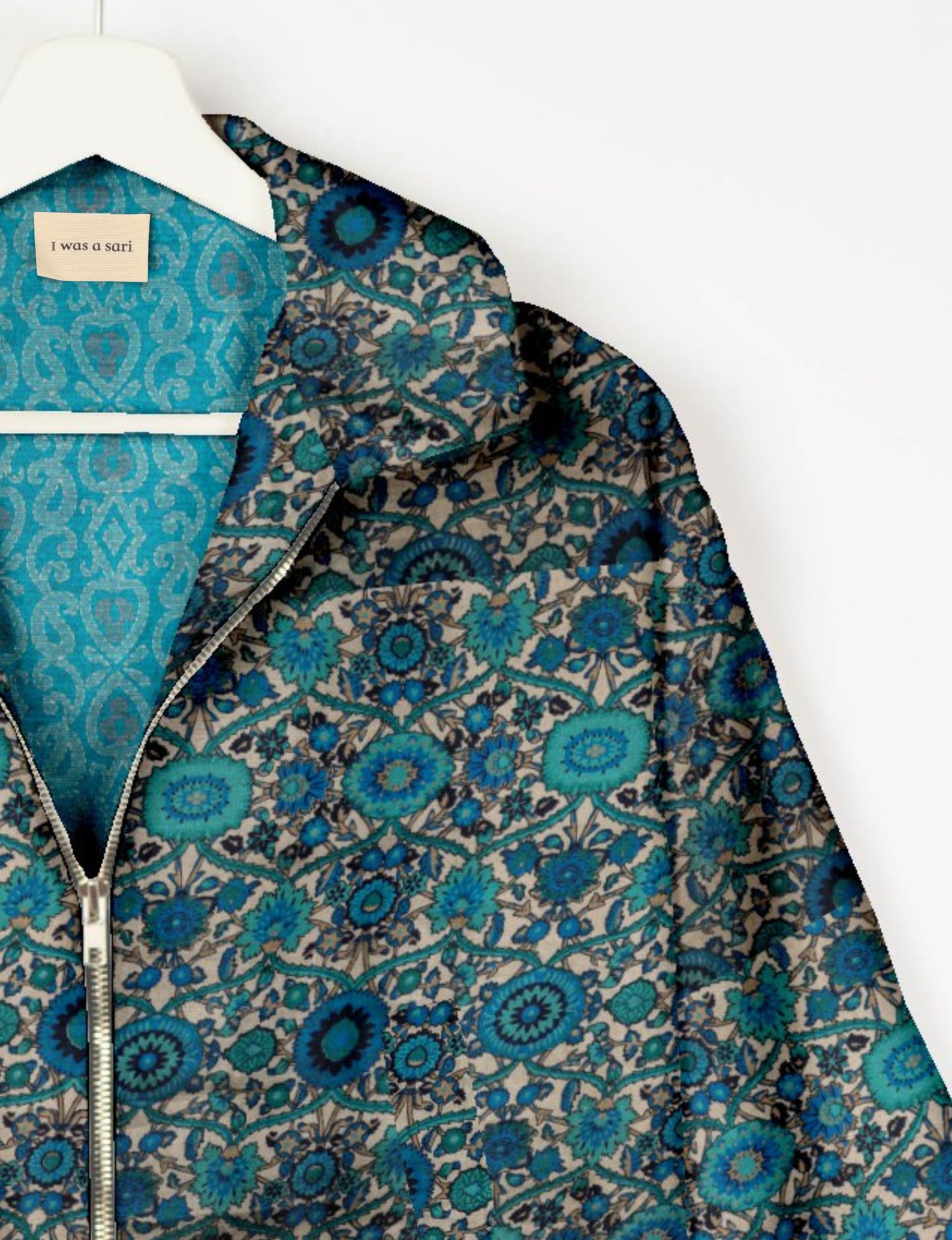 Upcycled Bomber Jacket made from recycled sari materials, featuring a cute cropped shape, elasticated hem and cuffs, and contrast sari print lining. Sustainable apparel promoting eco-friendly fashion and ethical clothing.