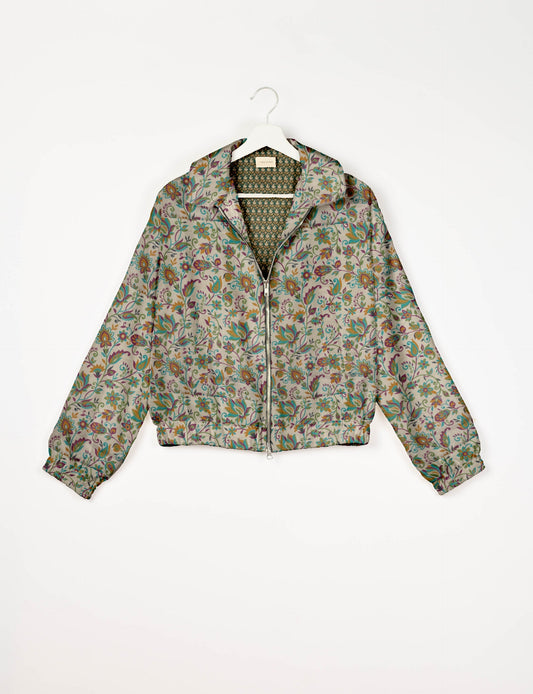 Upcycled Bomber Jacket made from recycled sari materials, featuring a cute cropped shape, elasticated hem and cuffs, and contrast sari print lining. Sustainable apparel promoting eco-friendly fashion and ethical clothing.