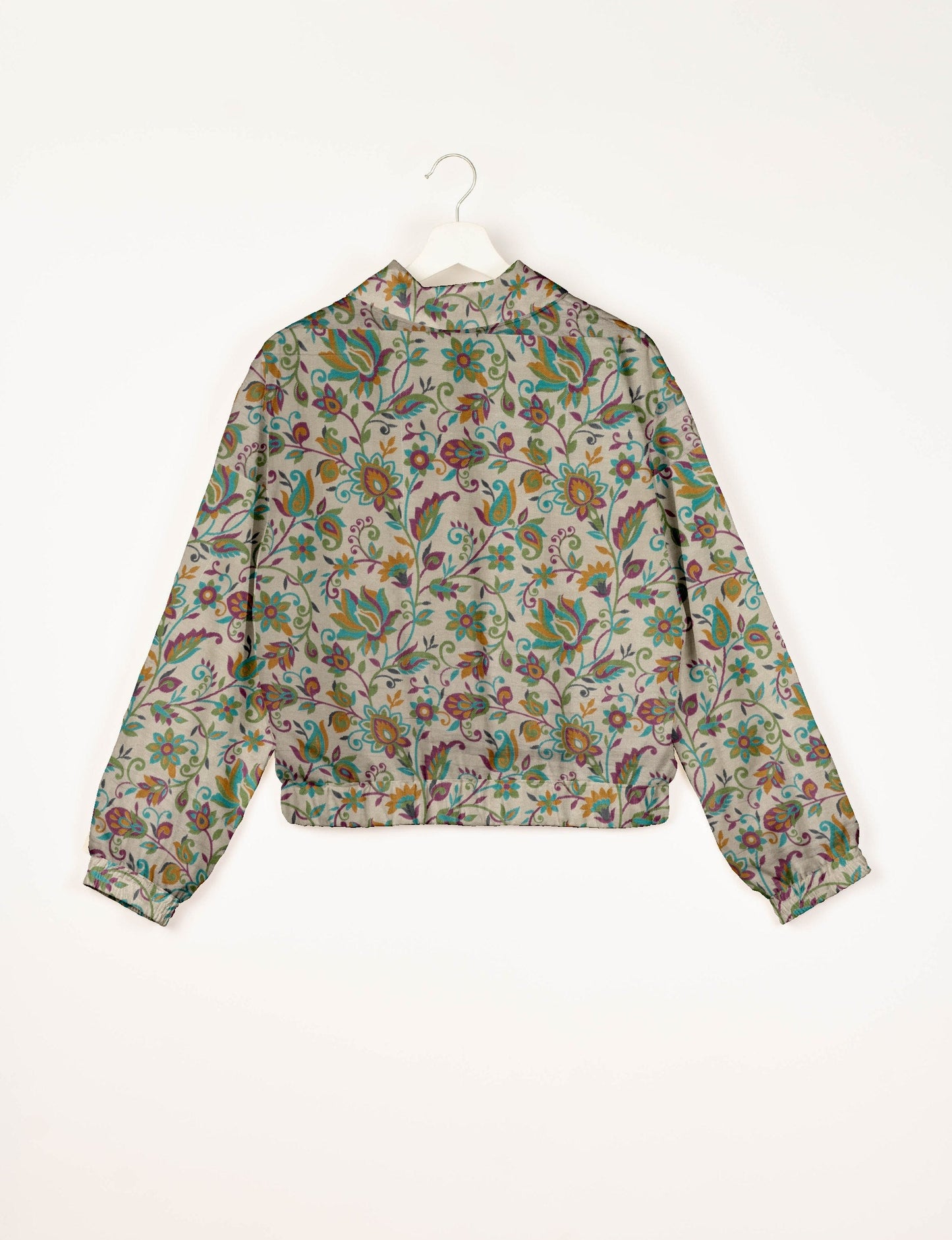 Upcycled Bomber Jacket made from recycled sari materials, featuring a cute cropped shape, elasticated hem and cuffs, and contrast sari print lining. Sustainable apparel promoting eco-friendly fashion and ethical clothing.