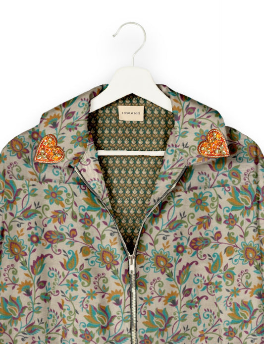 Make a bold statement with our Heart Drop Earrings, a symbol of conscious luxury and ethical fashion. Handcrafted using the intricate Aari embroidery technique, these earrings are made from upcycled sari fabric, embracing slow fashion and zero waste clothing. Elevate your look with sustainable apparel that supports fair trade fashion while reducing textile waste. Choose eco-friendly fashion that speaks of love, artistry, and responsibility.