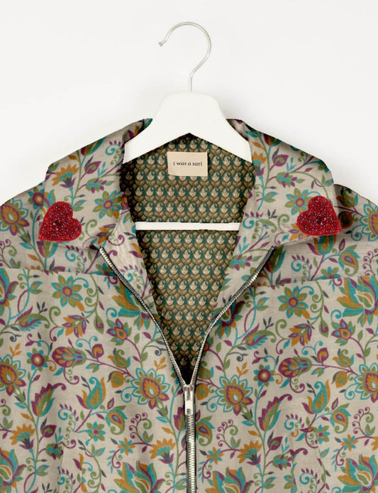 Make a bold statement with our Heart Drop Earrings, a symbol of conscious luxury and ethical fashion. Handcrafted using the intricate Aari embroidery technique, these earrings are made from upcycled sari fabric, embracing slow fashion and zero waste clothing. Elevate your look with sustainable apparel that supports fair trade fashion while reducing textile waste. Choose eco-friendly fashion that speaks of love, artistry, and responsibility.