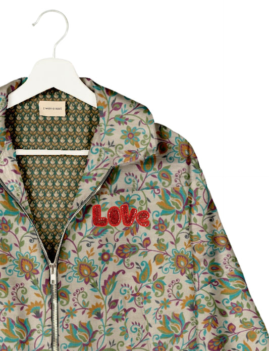 Love Bomber Jacket made from recycled fabric, featuring hand-stitched Aari embroidery. A unique piece of zero-waste clothing, part of the circular fashion movement. Designed with upcycled materials for a stylish yet environmentally friendly clothing choice.
