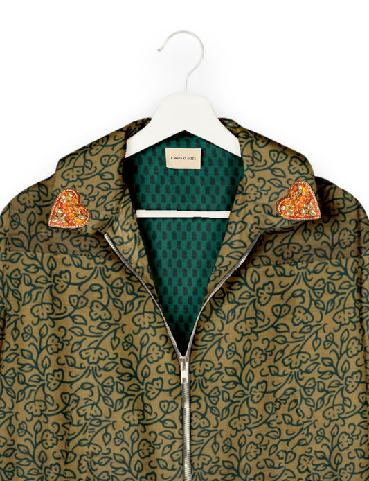 Make a bold statement with our Heart Drop Earrings, a symbol of conscious luxury and ethical fashion. Handcrafted using the intricate Aari embroidery technique, these earrings are made from upcycled sari fabric, embracing slow fashion and zero waste clothing. Elevate your look with sustainable apparel that supports fair trade fashion while reducing textile waste. Choose eco-friendly fashion that speaks of love, artistry, and responsibility.