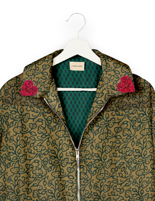 Make a bold statement with our Heart Drop Earrings, a symbol of conscious luxury and ethical fashion. Handcrafted using the intricate Aari embroidery technique, these earrings are made from upcycled sari fabric, embracing slow fashion and zero waste clothing. Elevate your look with sustainable apparel that supports fair trade fashion while reducing textile waste. Choose eco-friendly fashion that speaks of love, artistry, and responsibility.