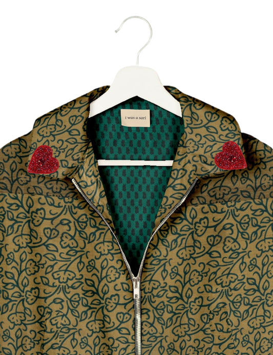 Make a bold statement with our Heart Drop Earrings, a symbol of conscious luxury and ethical fashion. Handcrafted using the intricate Aari embroidery technique, these earrings are made from upcycled sari fabric, embracing slow fashion and zero waste clothing. Elevate your look with sustainable apparel that supports fair trade fashion while reducing textile waste. Choose eco-friendly fashion that speaks of love, artistry, and responsibility.