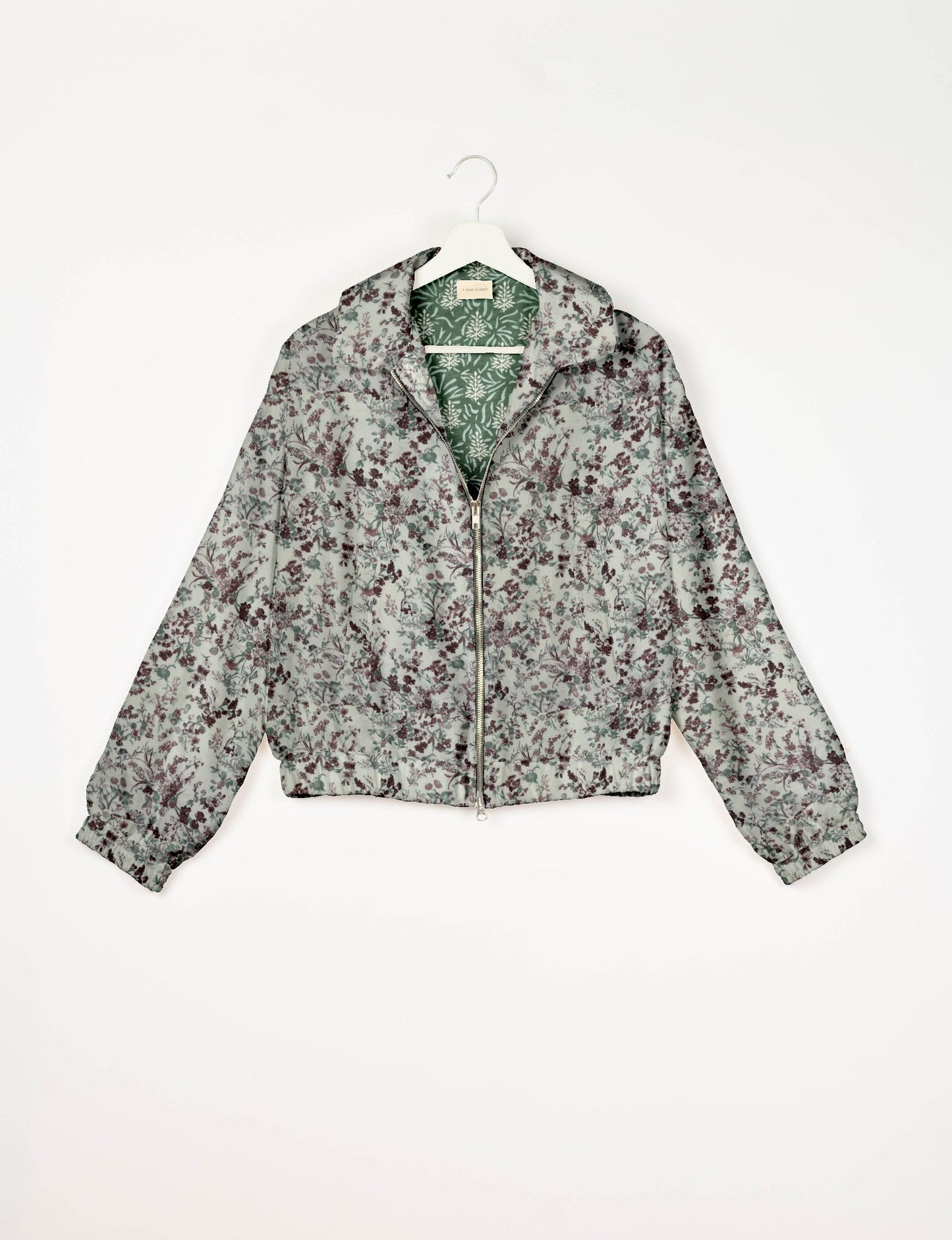 Upcycled Bomber Jacket made from recycled sari materials, featuring a cute cropped shape, elasticated hem and cuffs, and contrast sari print lining. Sustainable apparel promoting eco-friendly fashion and ethical clothing.