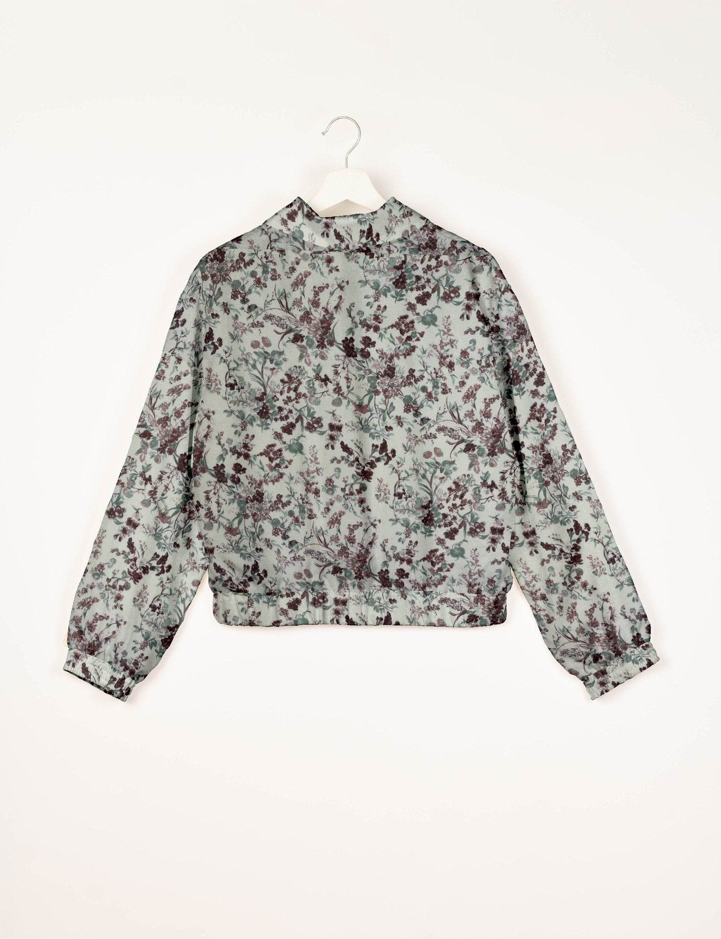 Upcycled Bomber Jacket made from recycled sari materials, featuring a cute cropped shape, elasticated hem and cuffs, and contrast sari print lining. Sustainable apparel promoting eco-friendly fashion and ethical clothing.