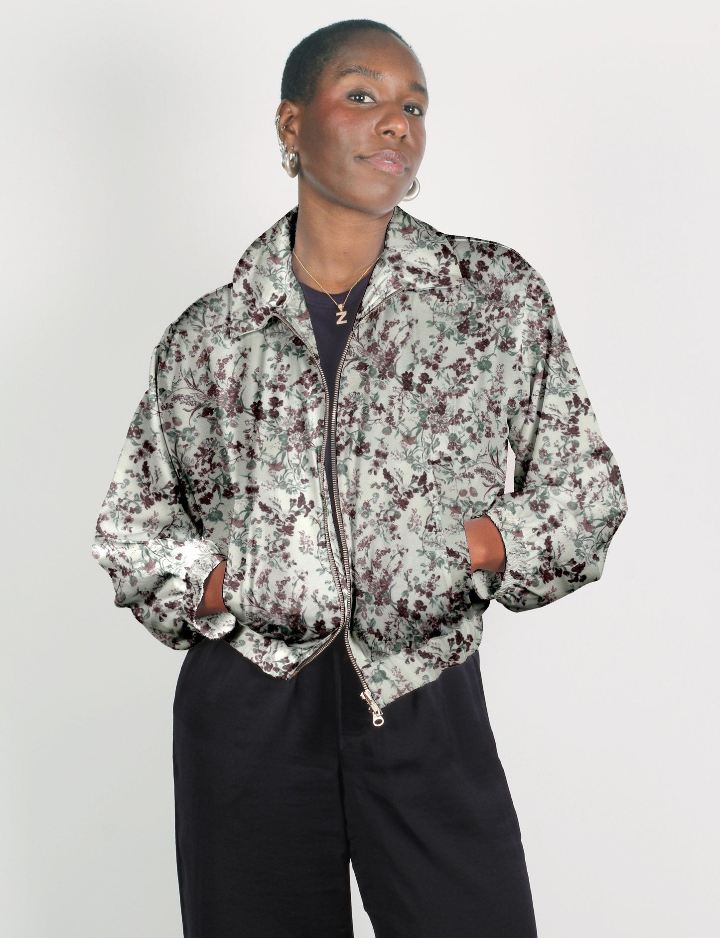 Upcycled Bomber Jacket made from recycled sari materials, featuring a cute cropped shape, elasticated hem and cuffs, and contrast sari print lining. Sustainable apparel promoting eco-friendly fashion and ethical clothing.