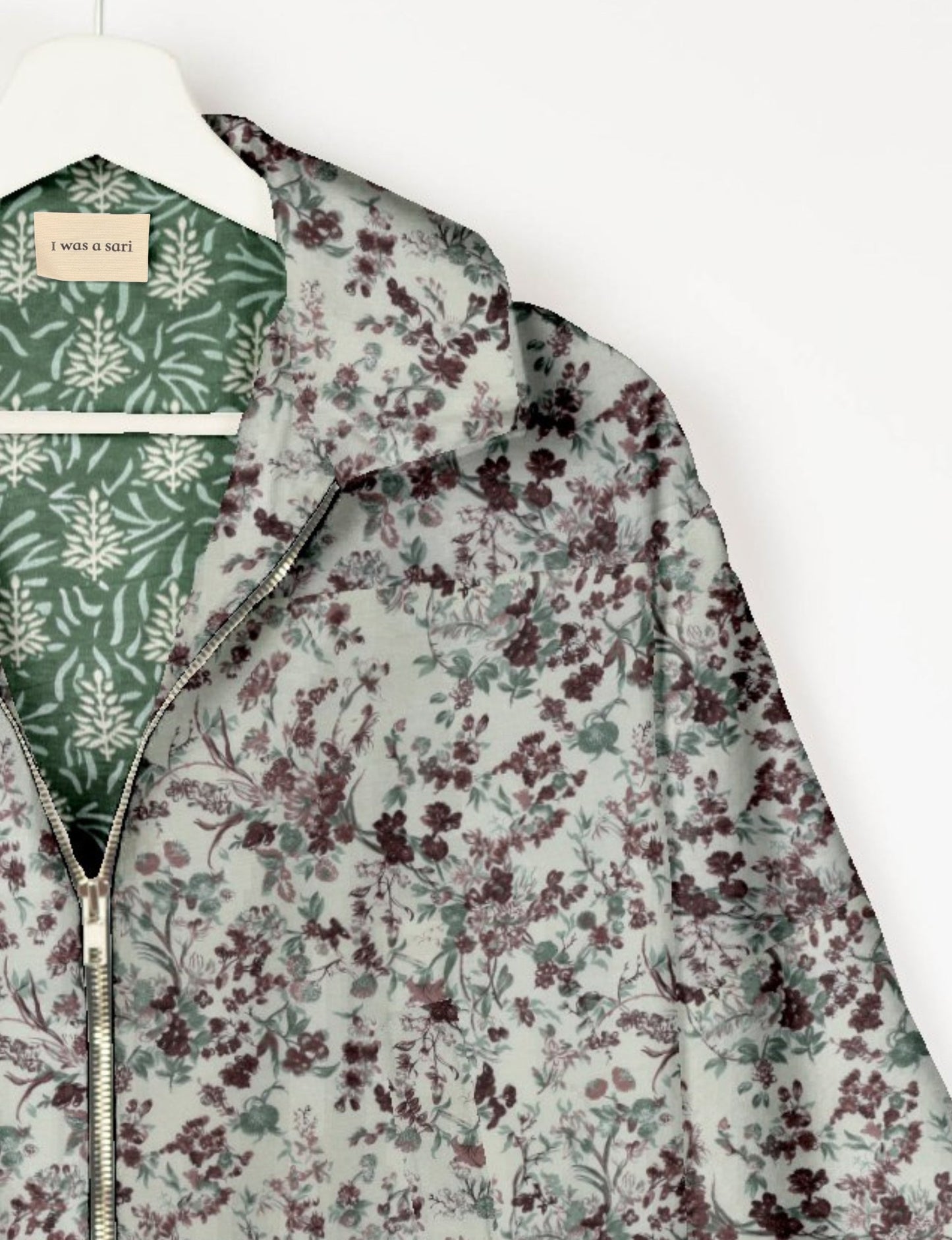 Upcycled Bomber Jacket made from recycled sari materials, featuring a cute cropped shape, elasticated hem and cuffs, and contrast sari print lining. Sustainable apparel promoting eco-friendly fashion and ethical clothing.