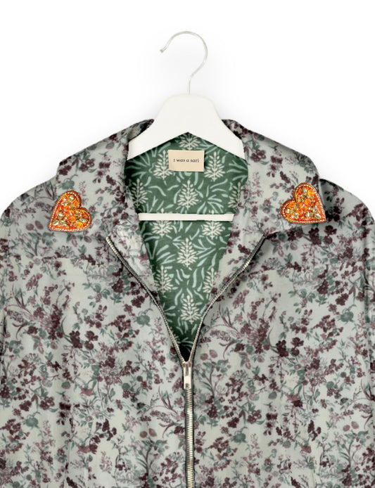 Make a bold statement with our Heart Drop Earrings, a symbol of conscious luxury and ethical fashion. Handcrafted using the intricate Aari embroidery technique, these earrings are made from upcycled sari fabric, embracing slow fashion and zero waste clothing. Elevate your look with sustainable apparel that supports fair trade fashion while reducing textile waste. Choose eco-friendly fashion that speaks of love, artistry, and responsibility.