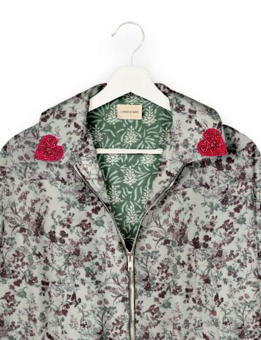 Make a bold statement with our Heart Drop Earrings, a symbol of conscious luxury and ethical fashion. Handcrafted using the intricate Aari embroidery technique, these earrings are made from upcycled sari fabric, embracing slow fashion and zero waste clothing. Elevate your look with sustainable apparel that supports fair trade fashion while reducing textile waste. Choose eco-friendly fashion that speaks of love, artistry, and responsibility.