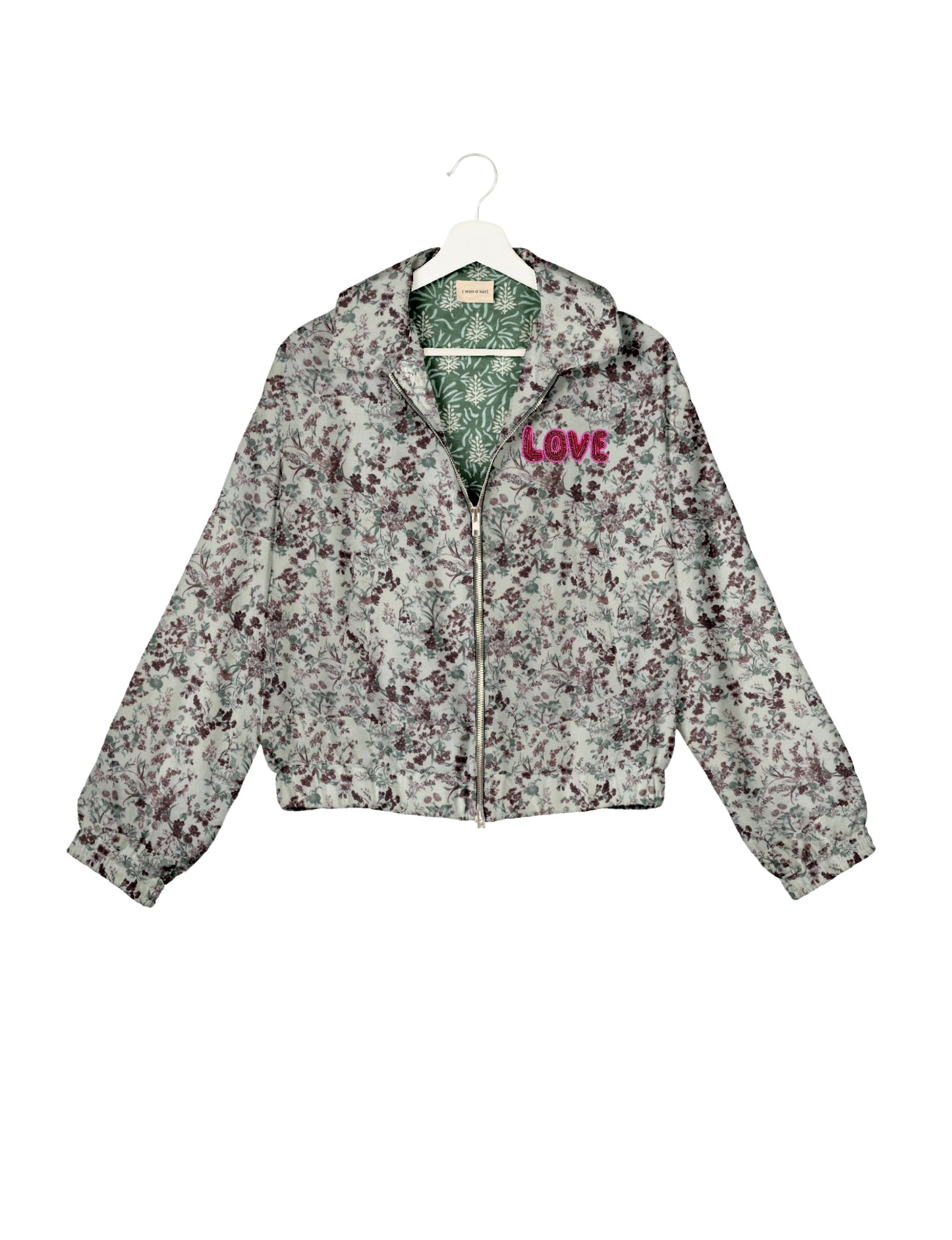 Love Bomber Jacket made from recycled fabric, featuring hand-stitched Aari embroidery. A unique piece of zero-waste clothing, part of the circular fashion movement. Designed with upcycled materials for a stylish yet environmentally friendly clothing choice.