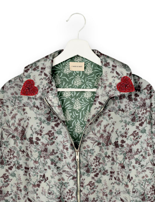 Make a bold statement with our Heart Drop Earrings, a symbol of conscious luxury and ethical fashion. Handcrafted using the intricate Aari embroidery technique, these earrings are made from upcycled sari fabric, embracing slow fashion and zero waste clothing. Elevate your look with sustainable apparel that supports fair trade fashion while reducing textile waste. Choose eco-friendly fashion that speaks of love, artistry, and responsibility.