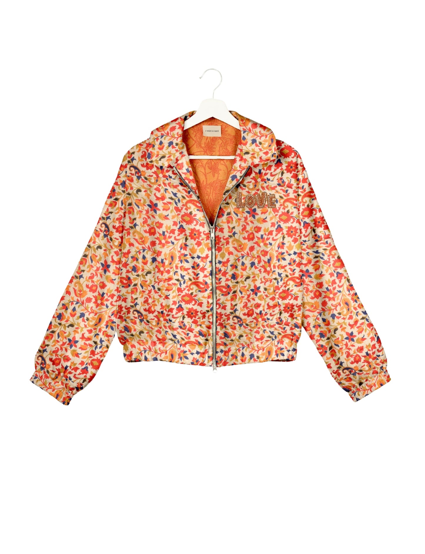 Love Bomber Jacket made from recycled fabric, featuring hand-stitched Aari embroidery. A unique piece of zero-waste clothing, part of the circular fashion movement. Designed with upcycled materials for a stylish yet environmentally friendly clothing choice.