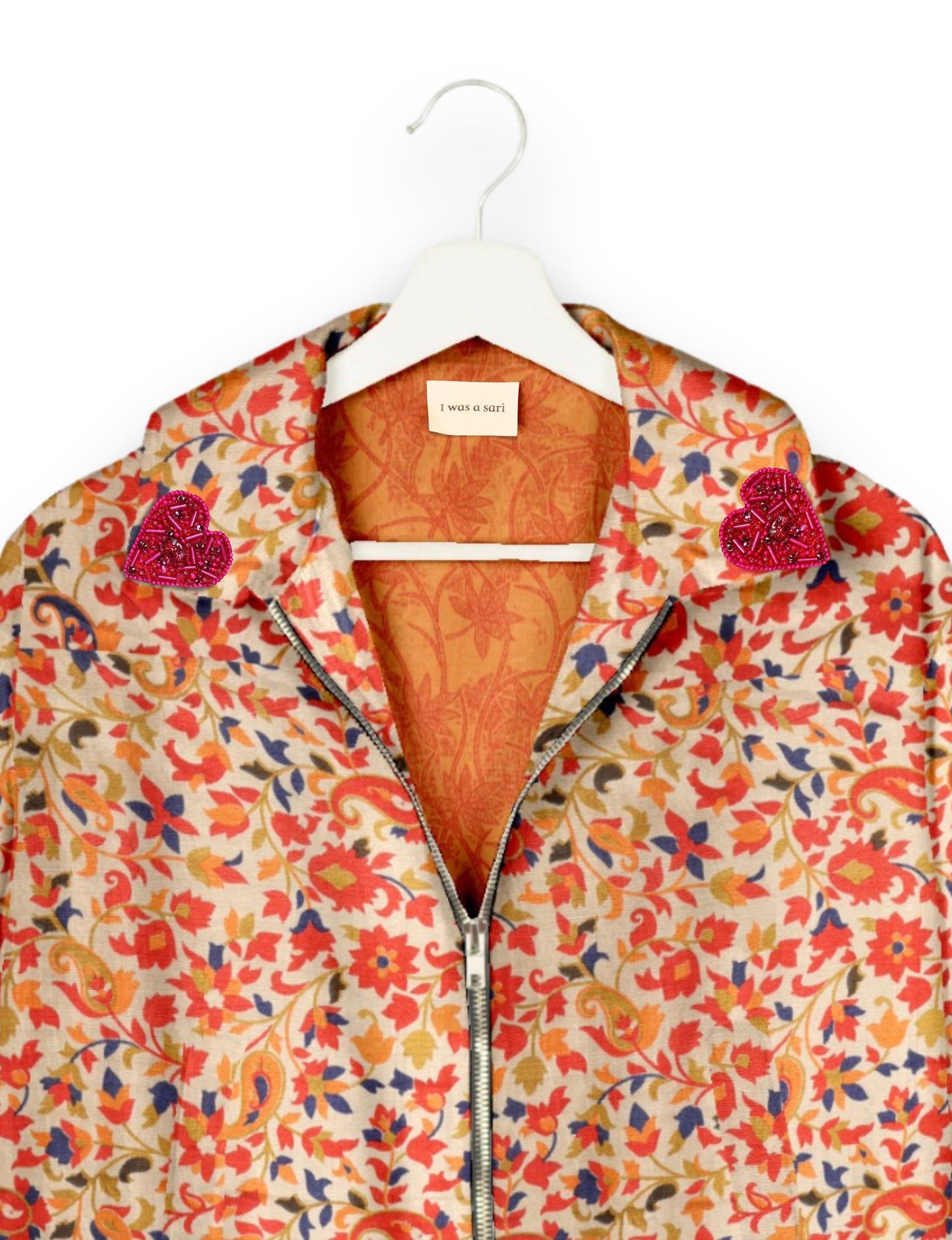 Make a bold statement with our Heart Drop Earrings, a symbol of conscious luxury and ethical fashion. Handcrafted using the intricate Aari embroidery technique, these earrings are made from upcycled sari fabric, embracing slow fashion and zero waste clothing. Elevate your look with sustainable apparel that supports fair trade fashion while reducing textile waste. Choose eco-friendly fashion that speaks of love, artistry, and responsibility.