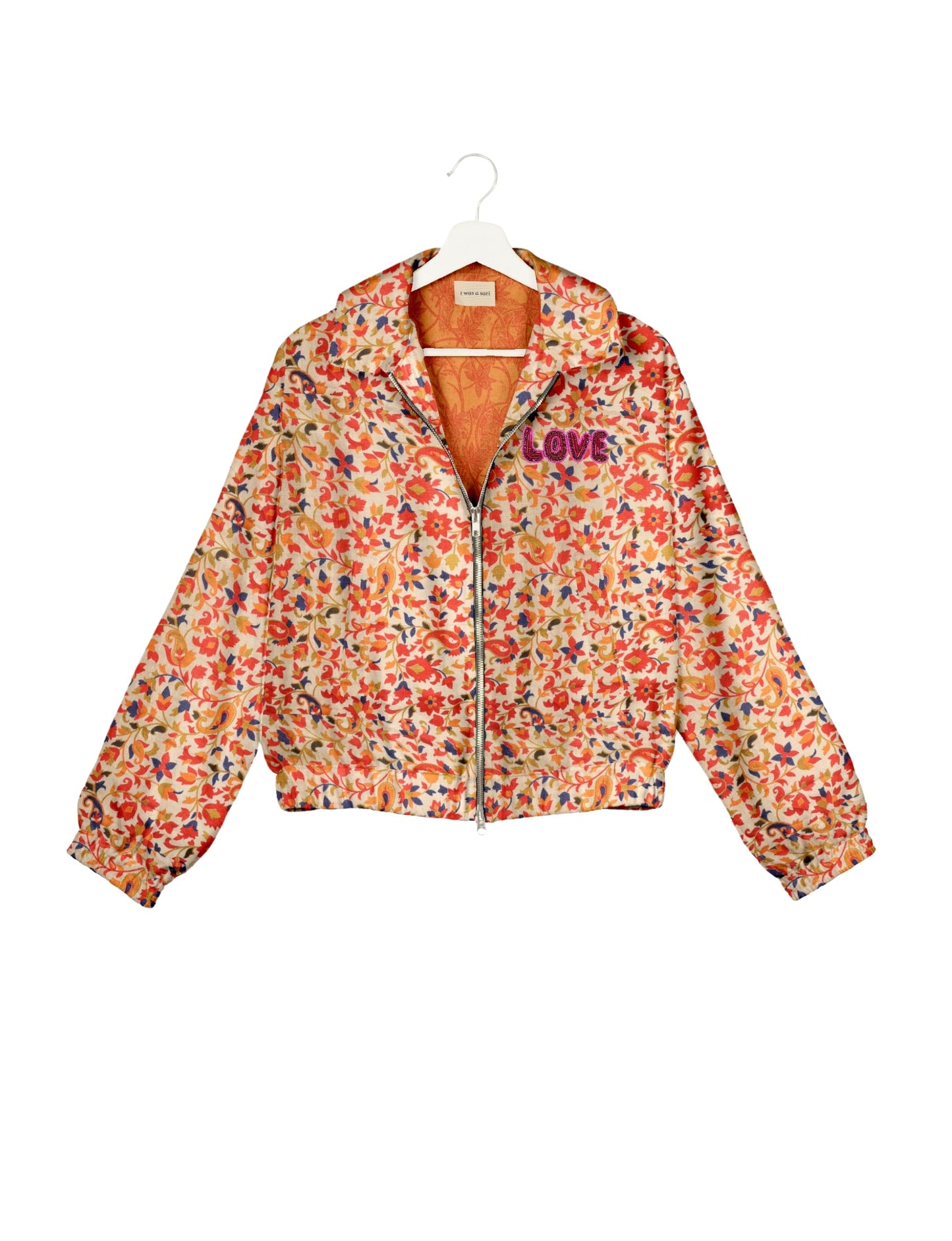 Love Bomber Jacket made from recycled fabric, featuring hand-stitched Aari embroidery. A unique piece of zero-waste clothing, part of the circular fashion movement. Designed with upcycled materials for a stylish yet environmentally friendly clothing choice.