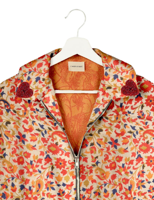 Make a bold statement with our Heart Drop Earrings, a symbol of conscious luxury and ethical fashion. Handcrafted using the intricate Aari embroidery technique, these earrings are made from upcycled sari fabric, embracing slow fashion and zero waste clothing. Elevate your look with sustainable apparel that supports fair trade fashion while reducing textile waste. Choose eco-friendly fashion that speaks of love, artistry, and responsibility.