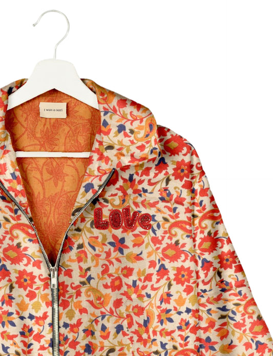 Love Bomber Jacket made from recycled fabric, featuring hand-stitched Aari embroidery. A unique piece of zero-waste clothing, part of the circular fashion movement. Designed with upcycled materials for a stylish yet environmentally friendly clothing choice.