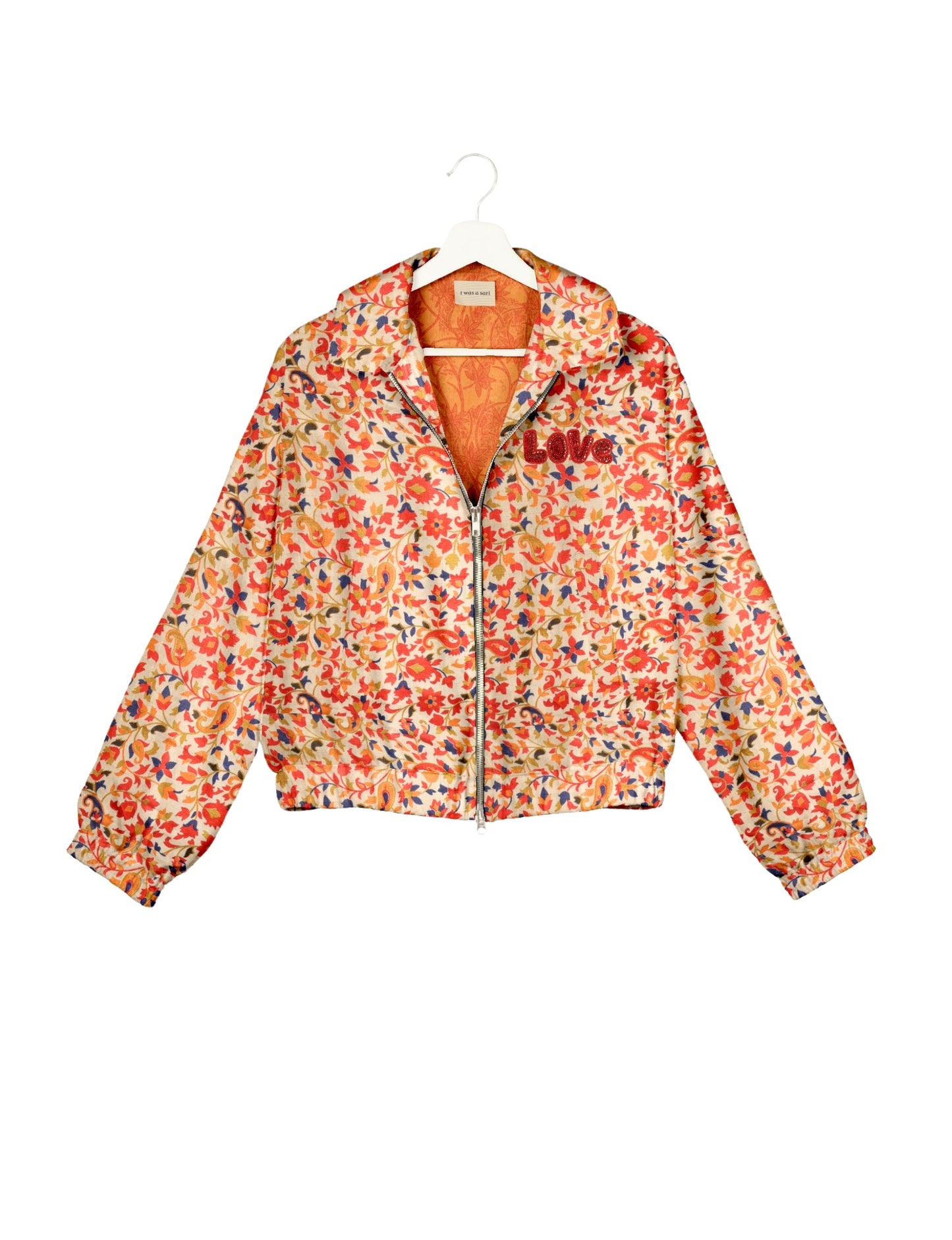 Love Bomber Jacket made from recycled fabric, featuring hand-stitched Aari embroidery. A unique piece of zero-waste clothing, part of the circular fashion movement. Designed with upcycled materials for a stylish yet environmentally friendly clothing choice.