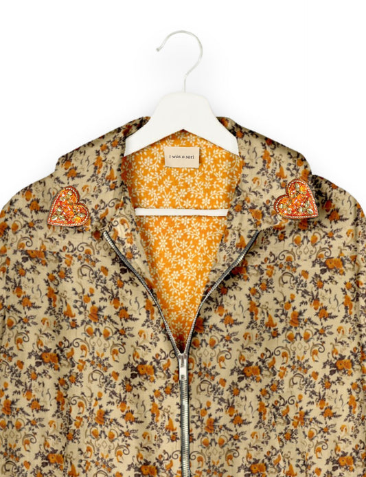 Make a bold statement with our Heart Drop Earrings, a symbol of conscious luxury and ethical fashion. Handcrafted using the intricate Aari embroidery technique, these earrings are made from upcycled sari fabric, embracing slow fashion and zero waste clothing. Elevate your look with sustainable apparel that supports fair trade fashion while reducing textile waste. Choose eco-friendly fashion that speaks of love, artistry, and responsibility.