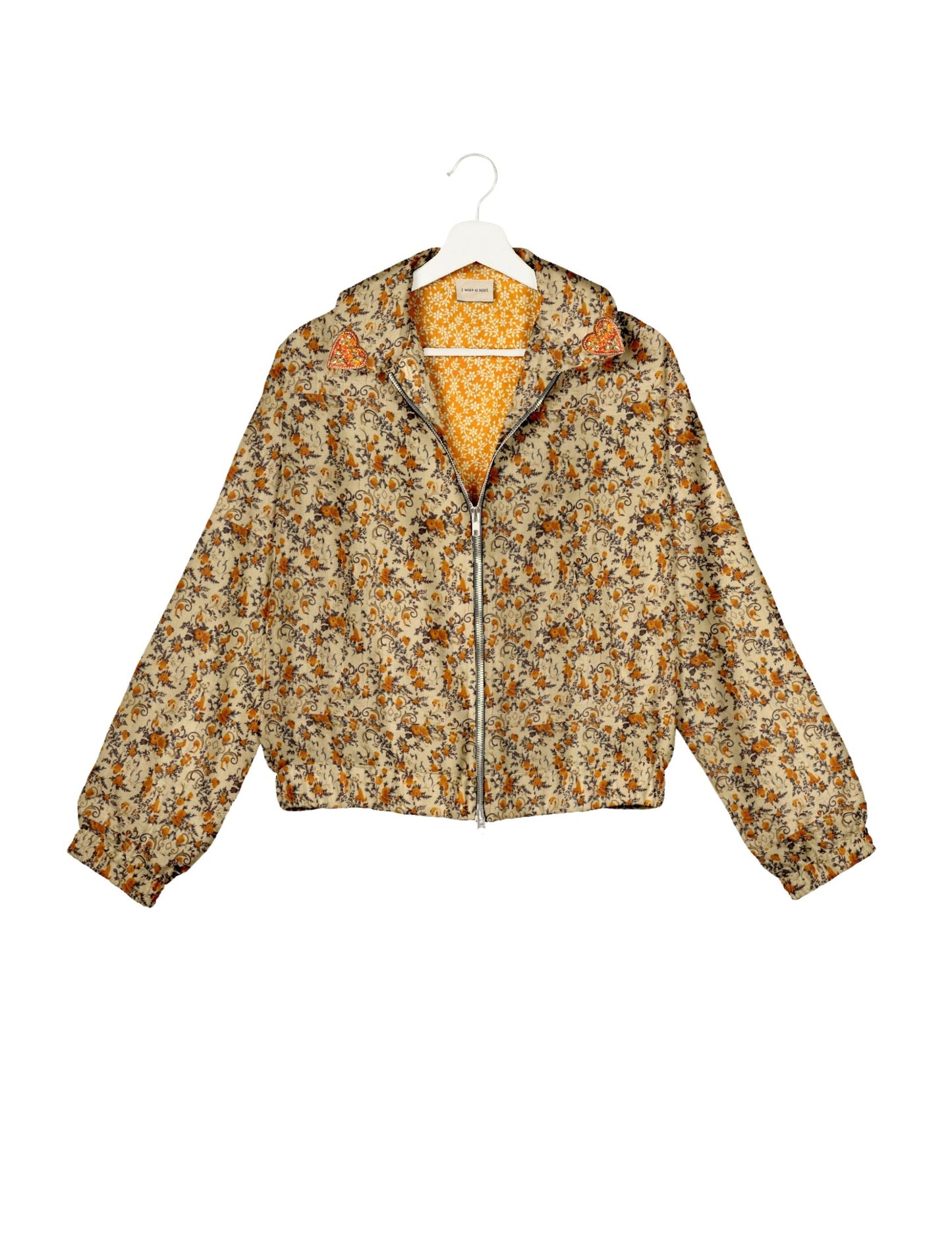 Make a bold statement with our Heart Drop Earrings, a symbol of conscious luxury and ethical fashion. Handcrafted using the intricate Aari embroidery technique, these earrings are made from upcycled sari fabric, embracing slow fashion and zero waste clothing. Elevate your look with sustainable apparel that supports fair trade fashion while reducing textile waste. Choose eco-friendly fashion that speaks of love, artistry, and responsibility.