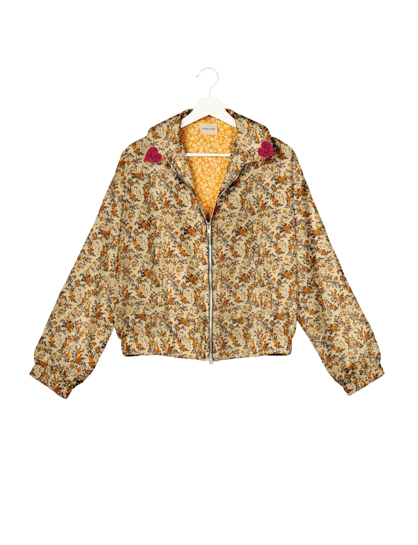 Make a bold statement with our Heart Drop Earrings, a symbol of conscious luxury and ethical fashion. Handcrafted using the intricate Aari embroidery technique, these earrings are made from upcycled sari fabric, embracing slow fashion and zero waste clothing. Elevate your look with sustainable apparel that supports fair trade fashion while reducing textile waste. Choose eco-friendly fashion that speaks of love, artistry, and responsibility.