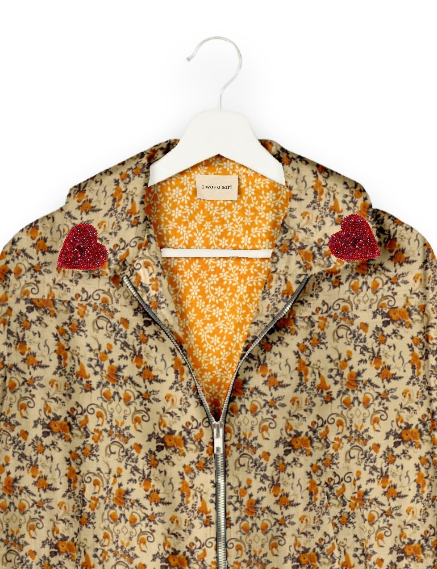 Make a bold statement with our Heart Drop Earrings, a symbol of conscious luxury and ethical fashion. Handcrafted using the intricate Aari embroidery technique, these earrings are made from upcycled sari fabric, embracing slow fashion and zero waste clothing. Elevate your look with sustainable apparel that supports fair trade fashion while reducing textile waste. Choose eco-friendly fashion that speaks of love, artistry, and responsibility.