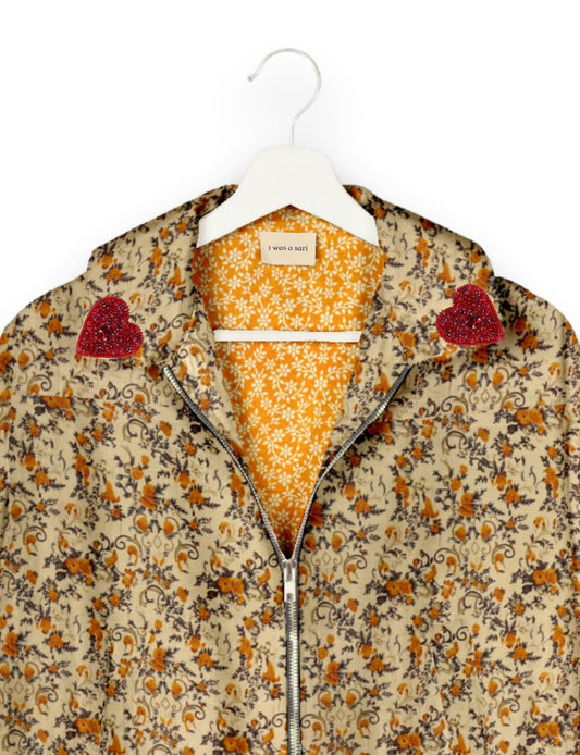 Make a bold statement with our Heart Drop Earrings, a symbol of conscious luxury and ethical fashion. Handcrafted using the intricate Aari embroidery technique, these earrings are made from upcycled sari fabric, embracing slow fashion and zero waste clothing. Elevate your look with sustainable apparel that supports fair trade fashion while reducing textile waste. Choose eco-friendly fashion that speaks of love, artistry, and responsibility.