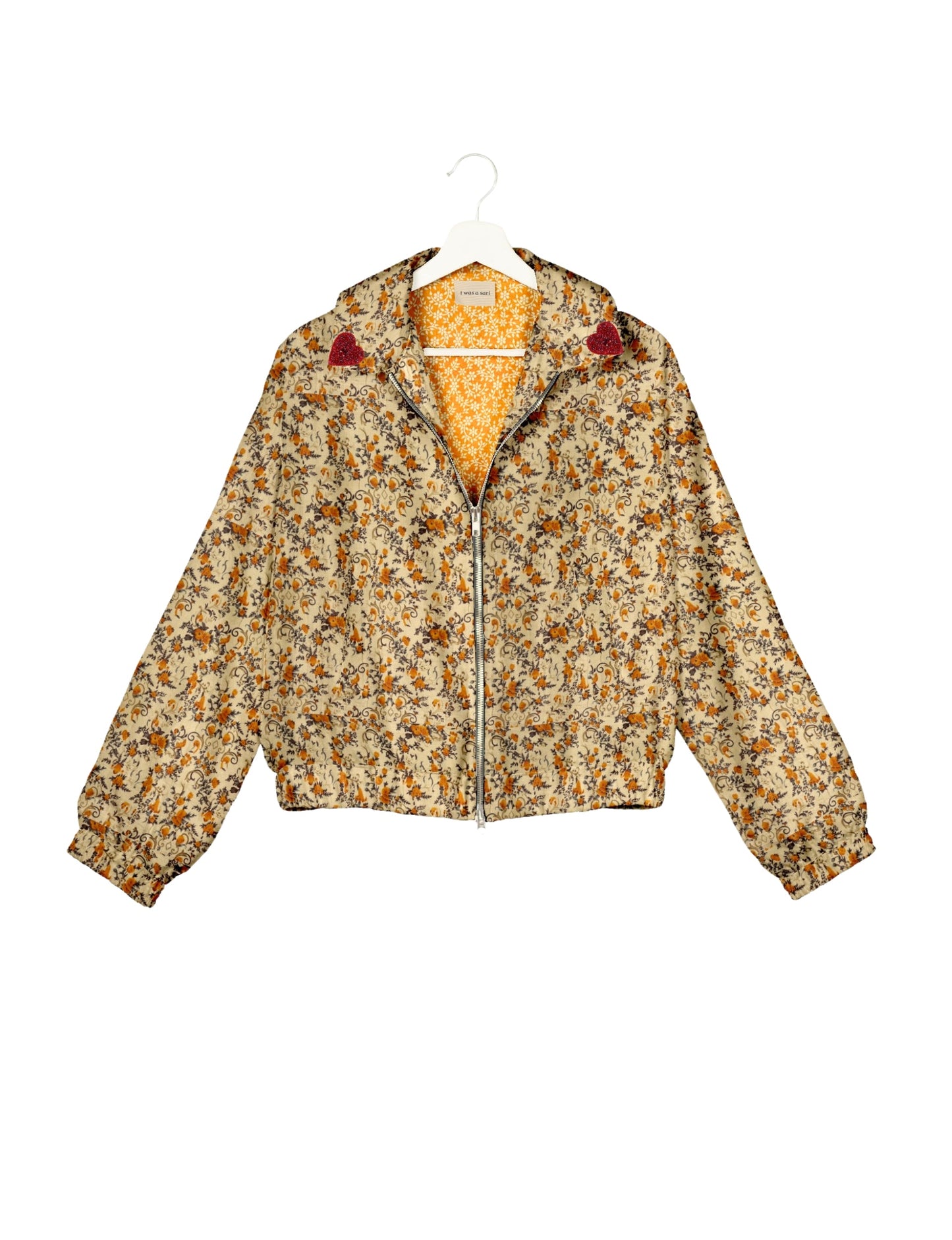 Make a bold statement with our Heart Drop Earrings, a symbol of conscious luxury and ethical fashion. Handcrafted using the intricate Aari embroidery technique, these earrings are made from upcycled sari fabric, embracing slow fashion and zero waste clothing. Elevate your look with sustainable apparel that supports fair trade fashion while reducing textile waste. Choose eco-friendly fashion that speaks of love, artistry, and responsibility.