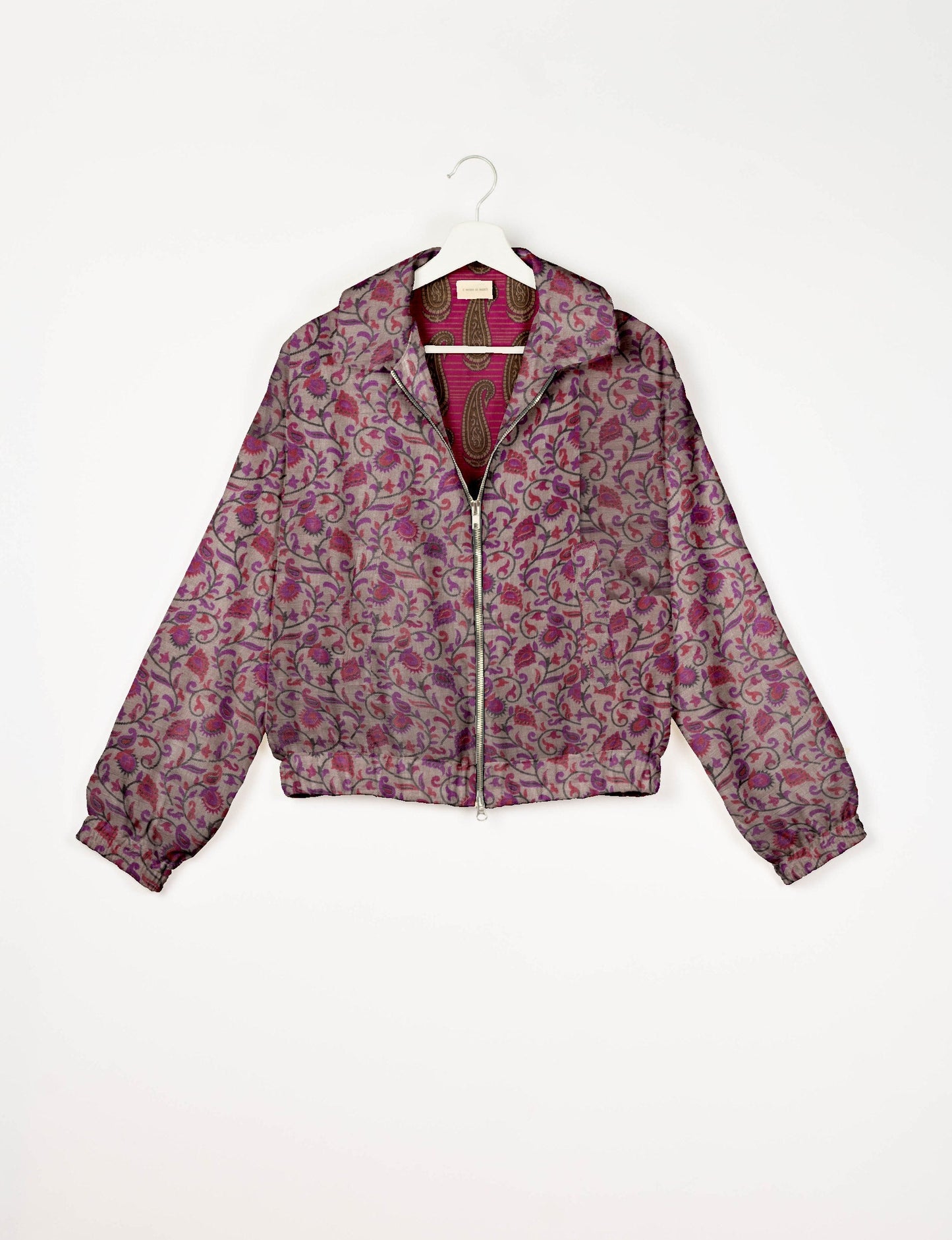 Upcycled Bomber Jacket made from recycled sari materials, featuring a cute cropped shape, elasticated hem and cuffs, and contrast sari print lining. Sustainable apparel promoting eco-friendly fashion and ethical clothing.