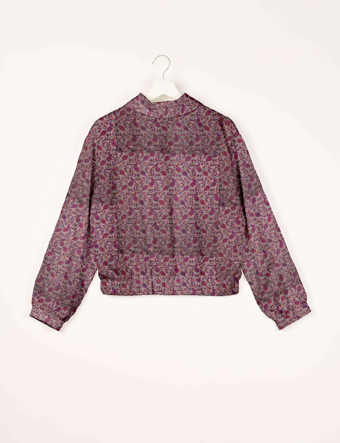 Upcycled Bomber Jacket made from recycled sari materials, featuring a cute cropped shape, elasticated hem and cuffs, and contrast sari print lining. Sustainable apparel promoting eco-friendly fashion and ethical clothing.