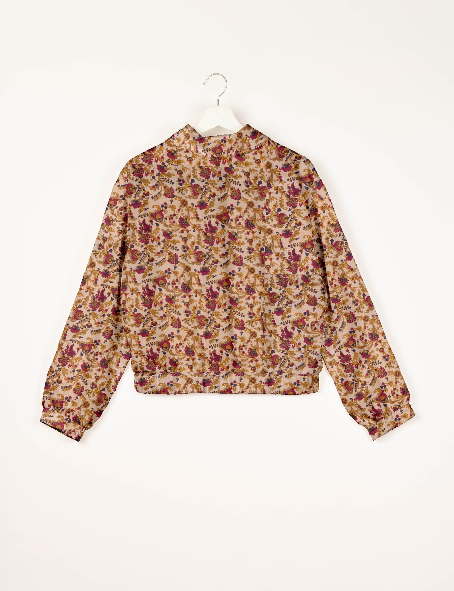 Stylish BOMBER JACKET, an upcycled clothing masterpiece with a cute cropped shape, elasticated details, and detachable metallic zipper. Contrast sari print lining adds a unique touch. Explore sustainable and eco-friendly fashion.