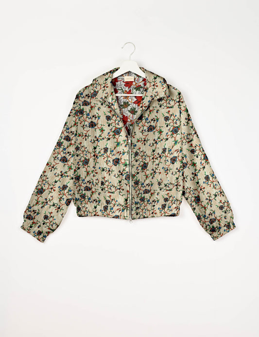 Upcycled Bomber Jacket made from recycled sari materials, featuring a cute cropped shape, elasticated hem and cuffs, and contrast sari print lining. Sustainable apparel promoting eco-friendly fashion and ethical clothing.