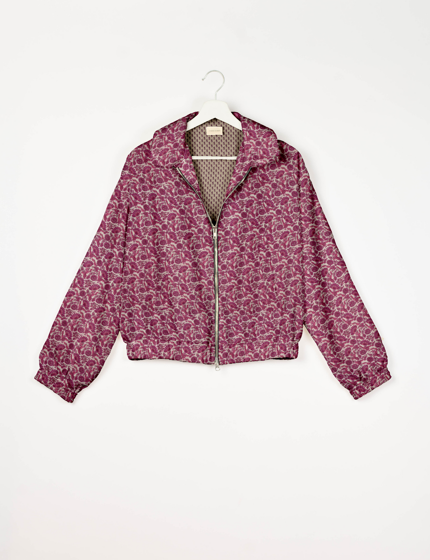 Upcycled Bomber Jacket made from recycled sari materials, featuring a cute cropped shape, elasticated hem and cuffs, and contrast sari print lining. Sustainable apparel promoting eco-friendly fashion and ethical clothing.