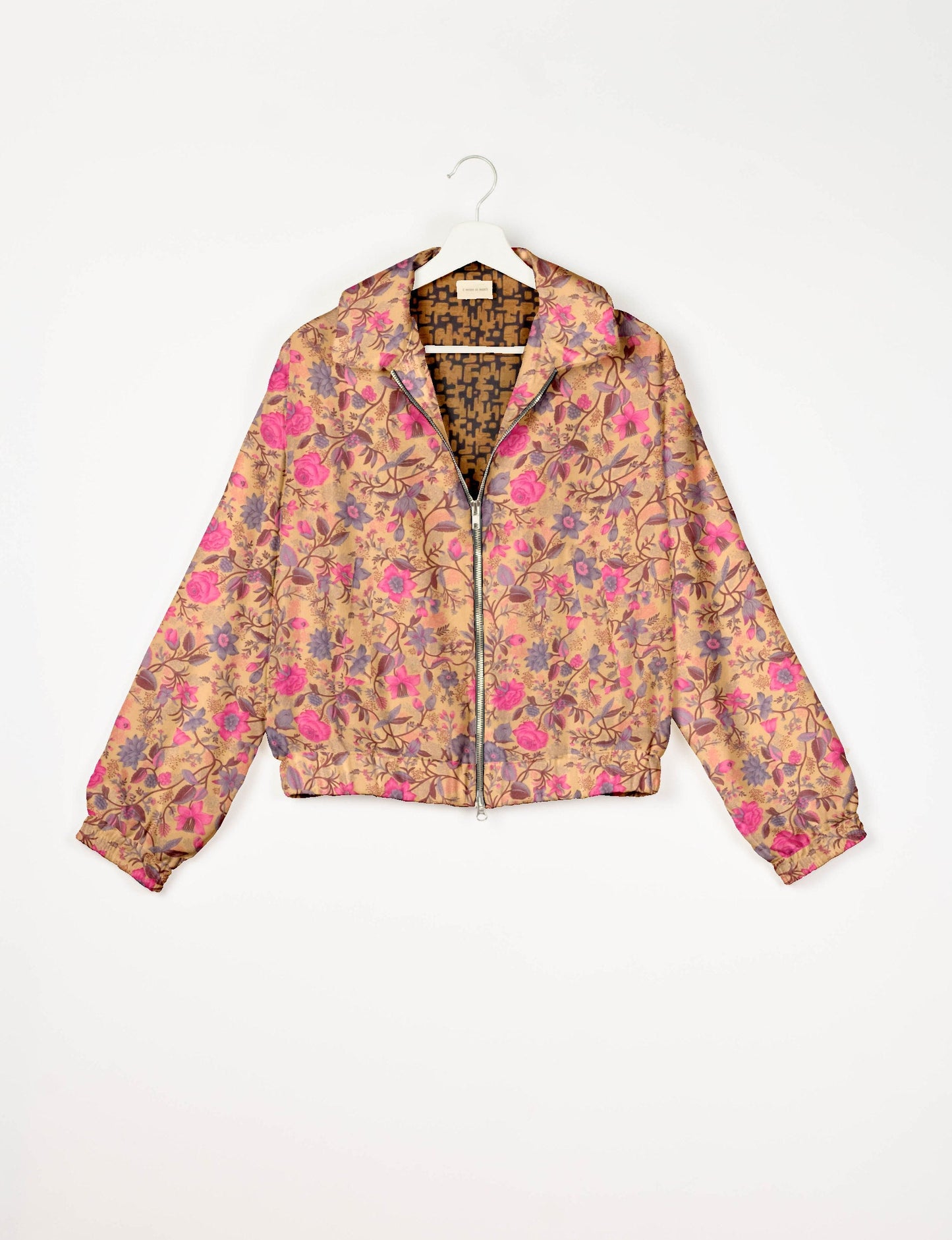 Stylish BOMBER JACKET, an upcycled clothing masterpiece with a cute cropped shape, elasticated details, and detachable metallic zipper. Contrast sari print lining adds a unique touch. Explore sustainable and eco-friendly fashion.