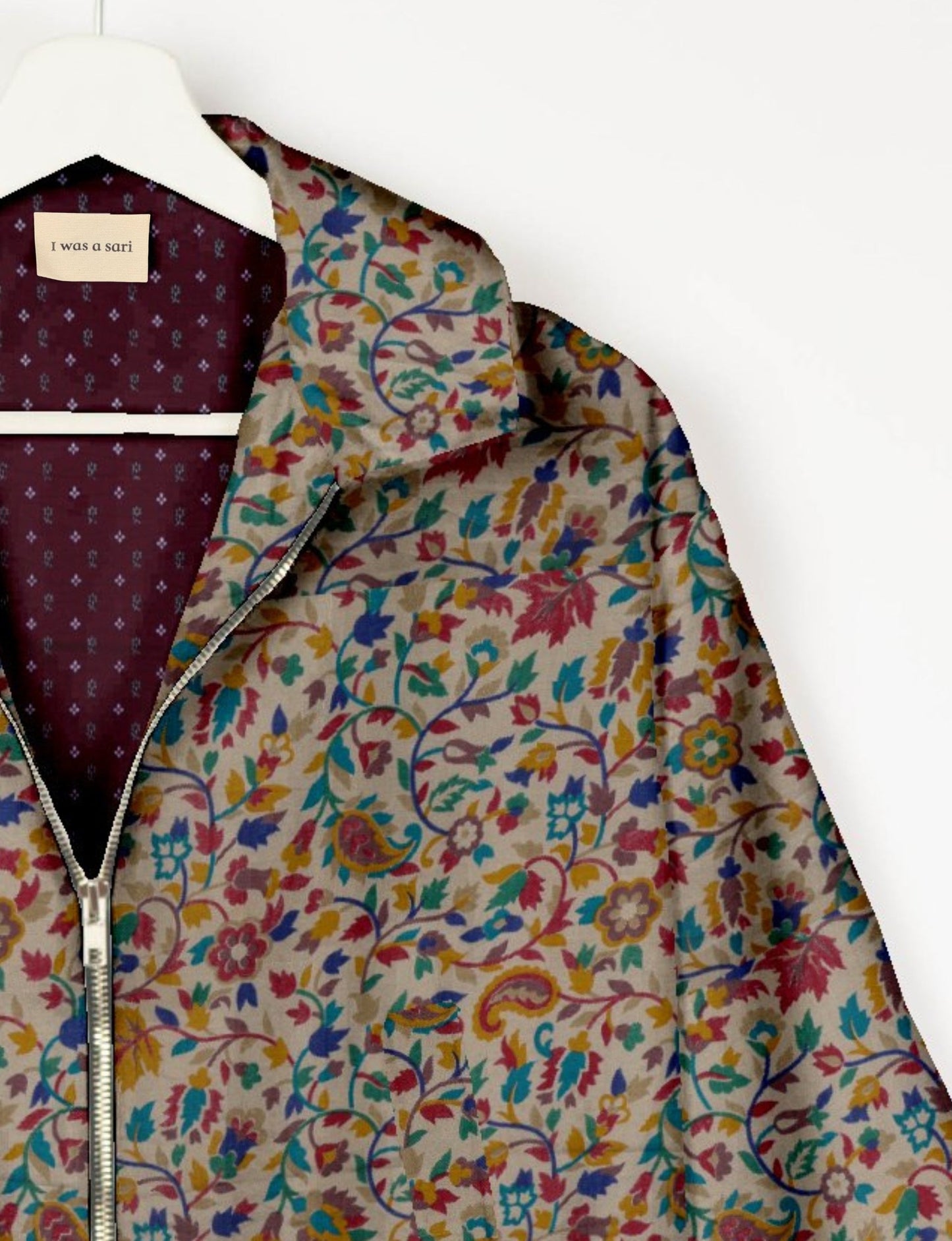 Upcycled Bomber Jacket made from recycled sari materials, featuring a cute cropped shape, elasticated hem and cuffs, and contrast sari print lining. Sustainable apparel promoting eco-friendly fashion and ethical clothing.