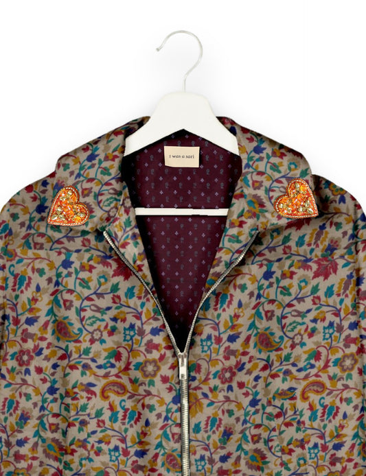 Make a bold statement with our Heart Drop Earrings, a symbol of conscious luxury and ethical fashion. Handcrafted using the intricate Aari embroidery technique, these earrings are made from upcycled sari fabric, embracing slow fashion and zero waste clothing. Elevate your look with sustainable apparel that supports fair trade fashion while reducing textile waste. Choose eco-friendly fashion that speaks of love, artistry, and responsibility.