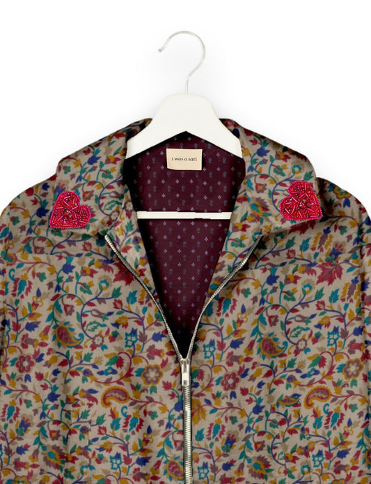 Make a bold statement with our Heart Drop Earrings, a symbol of conscious luxury and ethical fashion. Handcrafted using the intricate Aari embroidery technique, these earrings are made from upcycled sari fabric, embracing slow fashion and zero waste clothing. Elevate your look with sustainable apparel that supports fair trade fashion while reducing textile waste. Choose eco-friendly fashion that speaks of love, artistry, and responsibility.