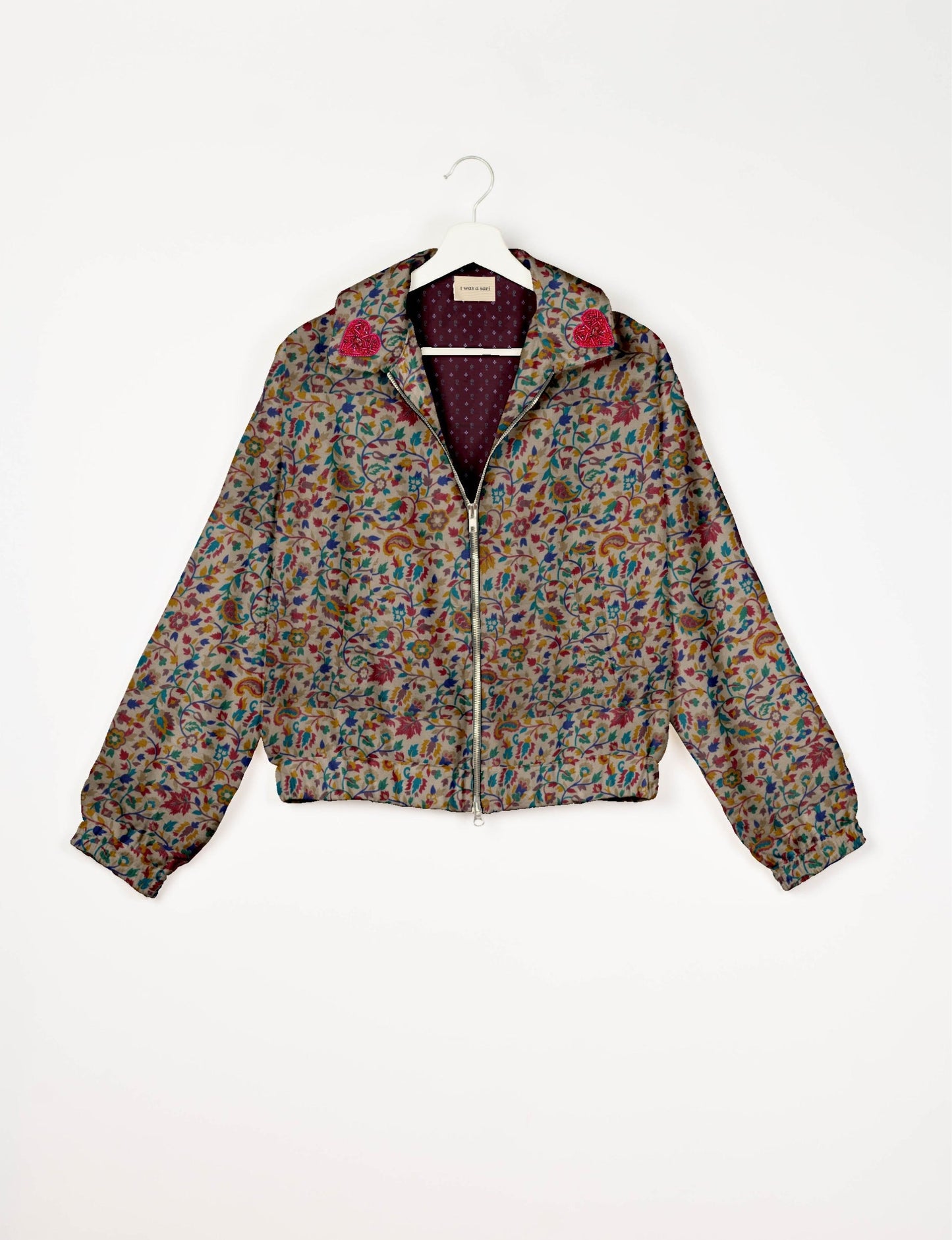 Make a bold statement with our Heart Drop Earrings, a symbol of conscious luxury and ethical fashion. Handcrafted using the intricate Aari embroidery technique, these earrings are made from upcycled sari fabric, embracing slow fashion and zero waste clothing. Elevate your look with sustainable apparel that supports fair trade fashion while reducing textile waste. Choose eco-friendly fashion that speaks of love, artistry, and responsibility.