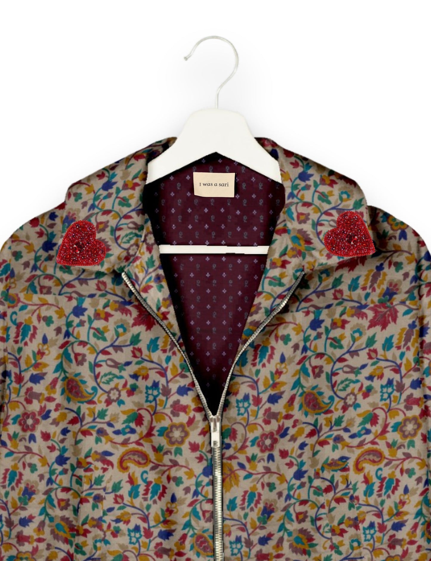 Make a bold statement with our Heart Drop Earrings, a symbol of conscious luxury and ethical fashion. Handcrafted using the intricate Aari embroidery technique, these earrings are made from upcycled sari fabric, embracing slow fashion and zero waste clothing. Elevate your look with sustainable apparel that supports fair trade fashion while reducing textile waste. Choose eco-friendly fashion that speaks of love, artistry, and responsibility.