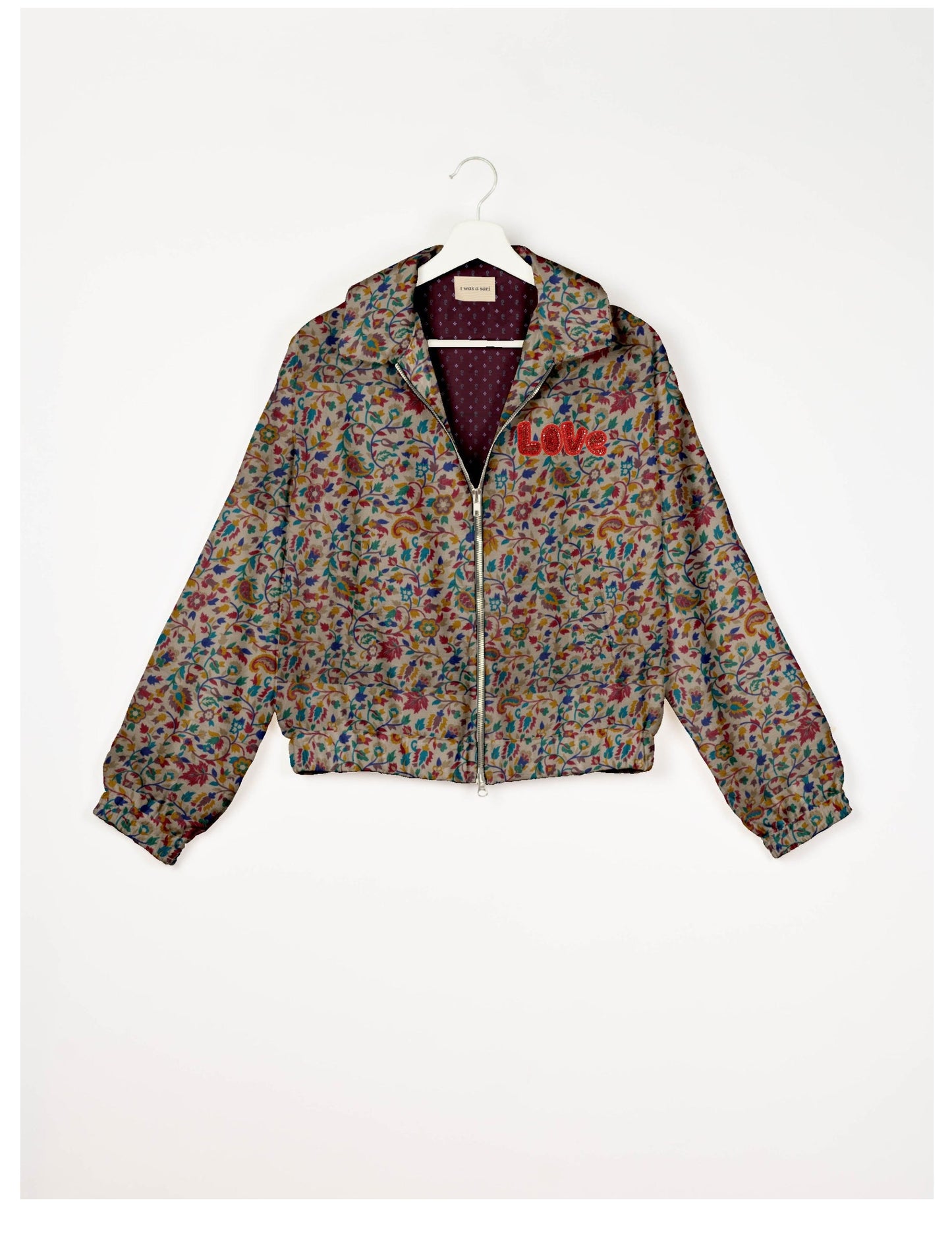 Love Bomber Jacket made from recycled fabric, featuring hand-stitched Aari embroidery. A unique piece of zero-waste clothing, part of the circular fashion movement. Designed with upcycled materials for a stylish yet environmentally friendly clothing choice.