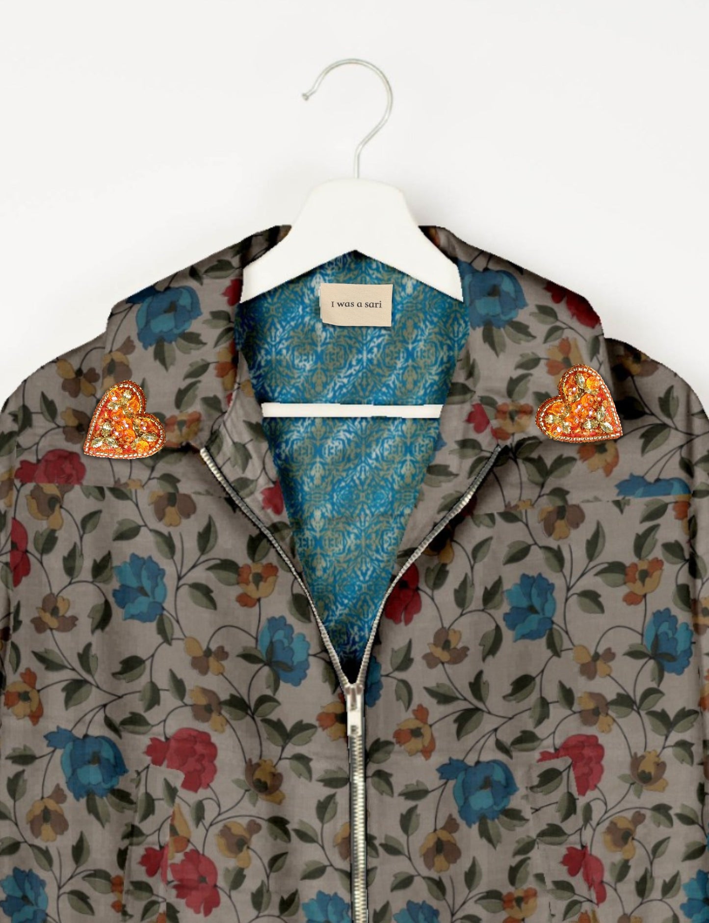 Make a bold statement with our Heart Drop Earrings, a symbol of conscious luxury and ethical fashion. Handcrafted using the intricate Aari embroidery technique, these earrings are made from upcycled sari fabric, embracing slow fashion and zero waste clothing. Elevate your look with sustainable apparel that supports fair trade fashion while reducing textile waste. Choose eco-friendly fashion that speaks of love, artistry, and responsibility.