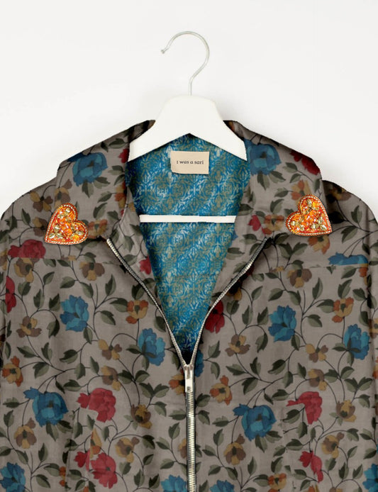 Make a bold statement with our Heart Drop Earrings, a symbol of conscious luxury and ethical fashion. Handcrafted using the intricate Aari embroidery technique, these earrings are made from upcycled sari fabric, embracing slow fashion and zero waste clothing. Elevate your look with sustainable apparel that supports fair trade fashion while reducing textile waste. Choose eco-friendly fashion that speaks of love, artistry, and responsibility.